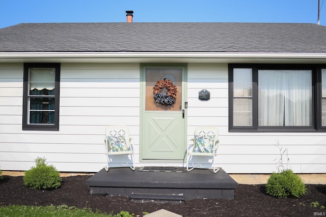 7420 S Fairfax Rd, Bloomington, IN 47401 - doorway to property with a shingled roof