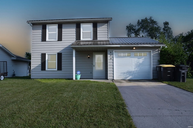 822 Aurora Knoll Ln, Fort Wayne, IN 46825 - traditional-style home featuring concrete driveway, a front yard, a standing seam roof, an attached garage, and a metal roof