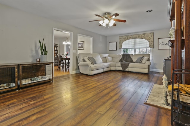 8855 Hickory Ln, Newburgh, IN 47630 - living area featuring ceiling fan, dark wood-style flooring, and a chandelier
