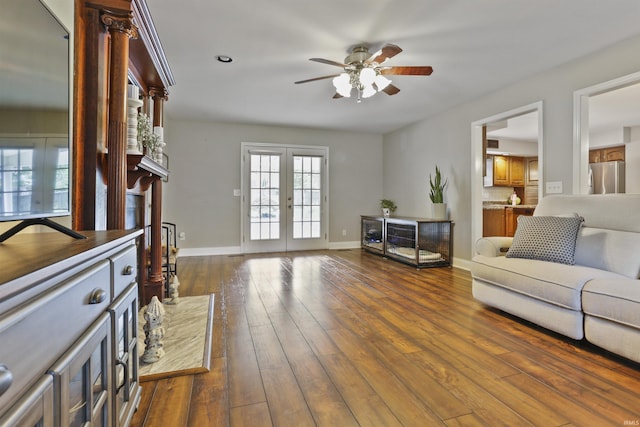 8855 Hickory Ln, Newburgh, IN 47630 - living room with french doors, a ceiling fan, dark wood-style flooring, and a fireplace