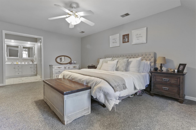 8855 Hickory Ln, Newburgh, IN 47630 - bedroom with light carpet, ensuite bath, and ceiling fan