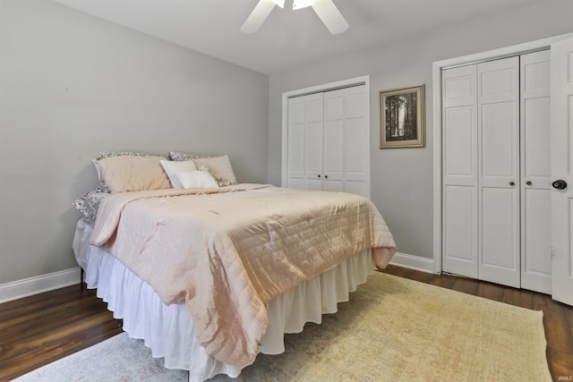 8855 Hickory Ln, Newburgh, IN 47630 - bedroom featuring two closets, dark wood finished floors, and ceiling fan