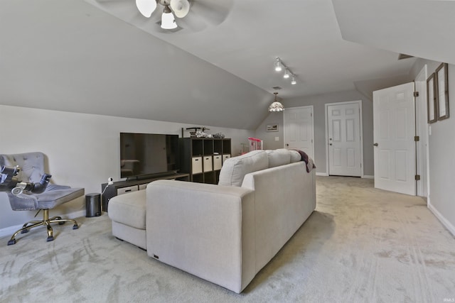 8855 Hickory Ln, Newburgh, IN 47630 - living area with light carpet, rail lighting, a ceiling fan, and lofted ceiling