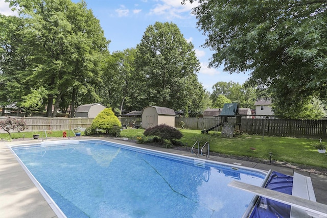 8855 Hickory Ln, Newburgh, IN 47630 - view of swimming pool with a storage shed, a fenced backyard, a playground, and a diving board