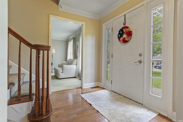8855 Hickory Ln, Newburgh, IN 47630 - foyer entrance with stairs, ornamental molding, and wood finished floors