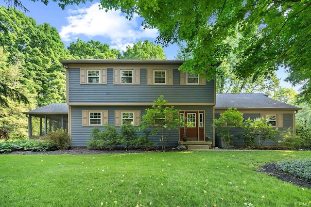3726 Capilano Dr, West Lafayette, IN 47906 - colonial-style house with a front yard, a sunroom, and entry steps
