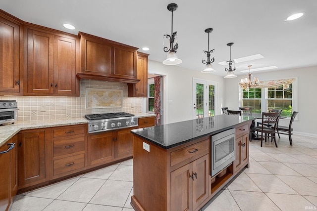 3726 Capilano Dr, West Lafayette, IN 47906 - kitchen with appliances with stainless steel finishes, light tile patterned floors, a skylight, tasteful backsplash, and recessed lighting