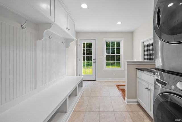 3726 Capilano Dr, West Lafayette, IN 47906 - laundry area with stacked washing machine and dryer, light tile patterned flooring, recessed lighting, and cabinet space