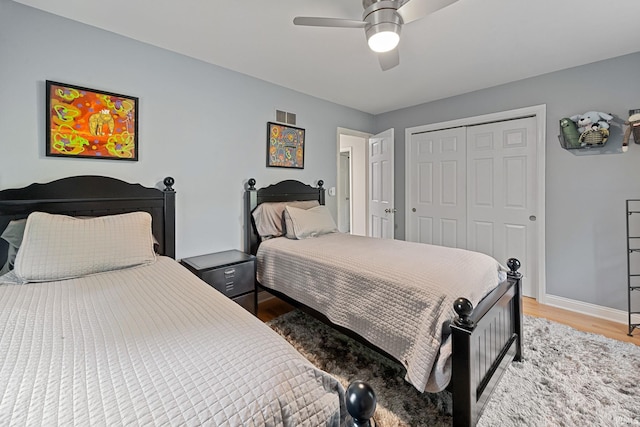 3726 Capilano Dr, West Lafayette, IN 47906 - bedroom with light wood-type flooring, a closet, and ceiling fan