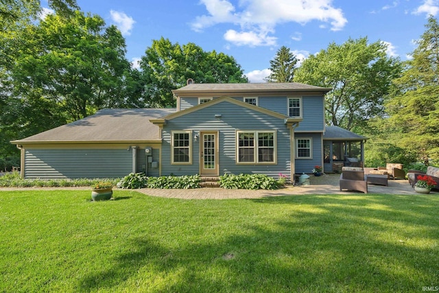 3726 Capilano Dr, West Lafayette, IN 47906 - back of property featuring a lawn, a chimney, an outdoor hangout area, and a patio