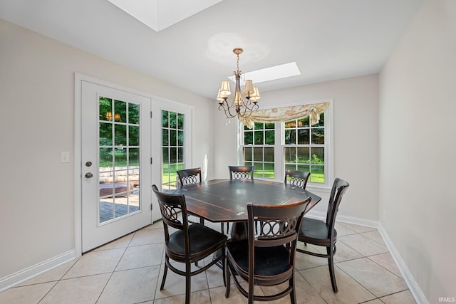 3726 Capilano Dr, West Lafayette, IN 47906 - dining area with a chandelier, a skylight, and light tile patterned flooring
