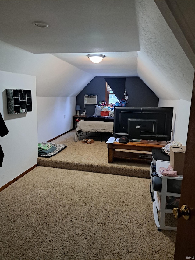 622 S Market St, Winamac, IN 46996 - carpeted bedroom with a wall unit AC and vaulted ceiling