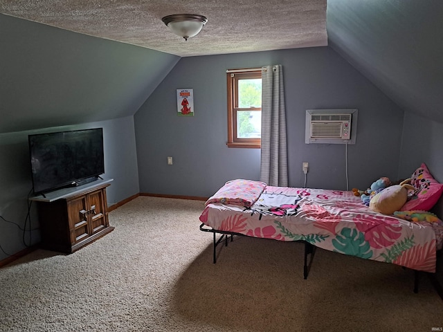 622 S Market St, Winamac, IN 46996 - carpeted bedroom with a wall unit AC, vaulted ceiling, and a textured ceiling