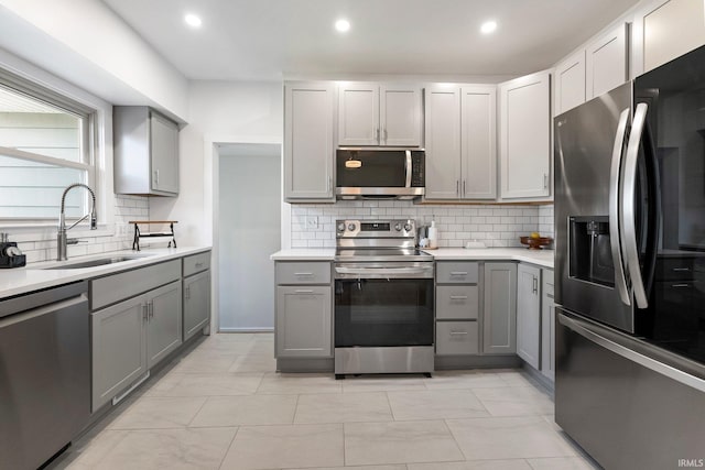 4230 Tacoma Ave, Fort Wayne, IN 46807 - kitchen with stainless steel appliances, gray cabinetry, tasteful backsplash, light countertops, and recessed lighting