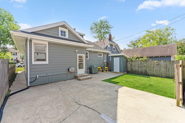 4230 Tacoma Ave, Fort Wayne, IN 46807 - back of property with a patio and a storage unit