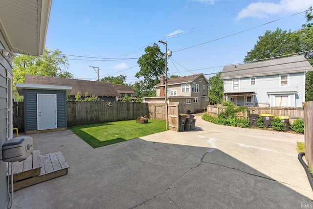 4230 Tacoma Ave, Fort Wayne, IN 46807 - fenced backyard featuring a patio area and a storage shed