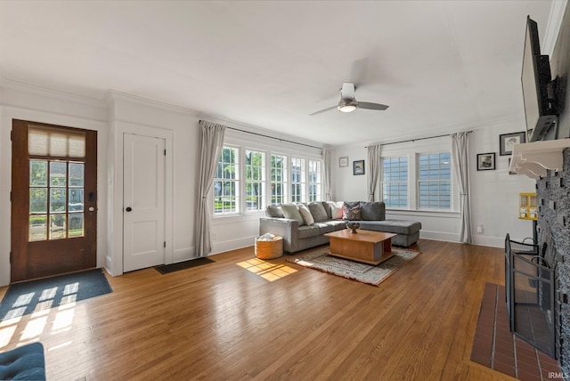 4230 Tacoma Ave, Fort Wayne, IN 46807 - living room featuring hardwood / wood-style floors, a ceiling fan, crown molding, and a fireplace with flush hearth