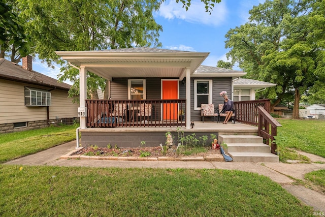 919 S 18th St, Lafayette, IN 47905 - bungalow-style home with a front yard, a porch, and roof with shingles