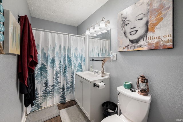 919 S 18th St, Lafayette, IN 47905 - full bath with vanity, wood finished floors, a textured ceiling, and a shower with shower curtain