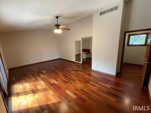 7030 Windshire Dr, Fort Wayne, IN 46814 - empty room with wood finished floors, ceiling fan, and lofted ceiling