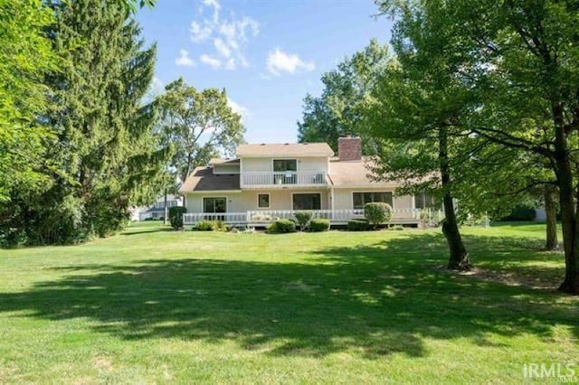 7030 Windshire Dr, Fort Wayne, IN 46814 - back of property with a yard, a chimney, and a deck