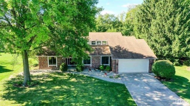 7030 Windshire Dr, Fort Wayne, IN 46814 - view of front facade featuring an attached garage, concrete driveway, and a front yard