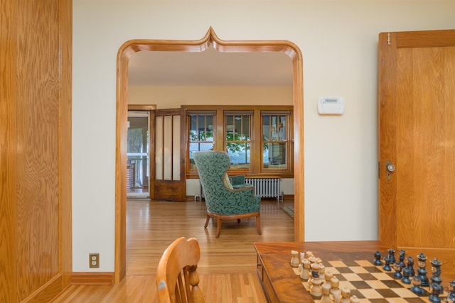 209 S 2nd St, Rockport, IN 47635 - hallway featuring wood finished floors and radiator heating unit