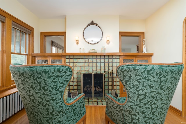 209 S 2nd St, Rockport, IN 47635 - sitting room featuring radiator heating unit and wood finished floors