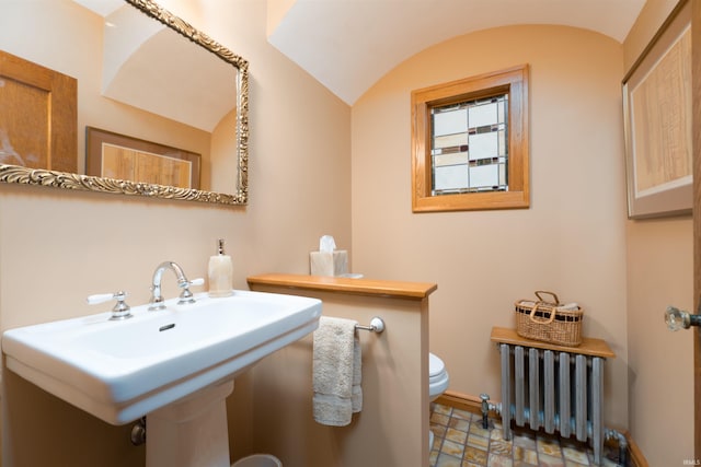 209 S 2nd St, Rockport, IN 47635 - bathroom with radiator, lofted ceiling, and stone finish flooring
