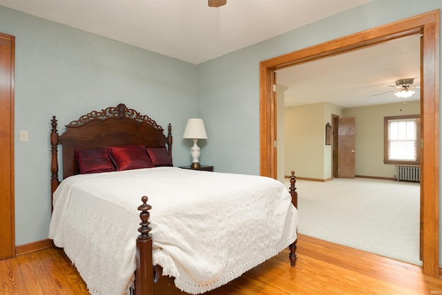 209 S 2nd St, Rockport, IN 47635 - bedroom featuring radiator, wood finished floors, and ceiling fan