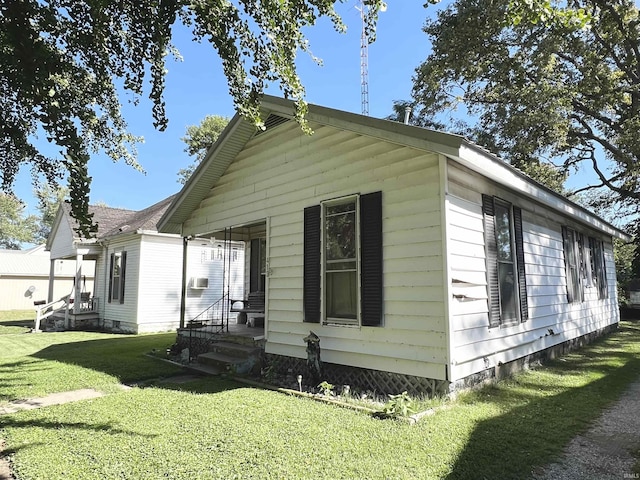413 W 2nd St, Mount Carmel, IL 62863 - view of property exterior featuring a yard