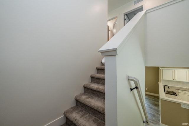 305 Hill Top Ct, New Carlisle, IN 46552 - staircase featuring baseboards and wood finished floors