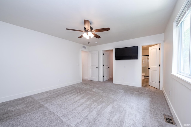 305 Hill Top Ct, New Carlisle, IN 46552 - unfurnished bedroom featuring multiple windows, light colored carpet, and ceiling fan