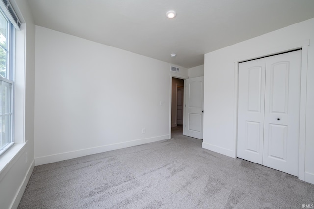 305 Hill Top Ct, New Carlisle, IN 46552 - unfurnished bedroom featuring carpet floors and a closet