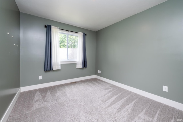 305 Hill Top Ct, New Carlisle, IN 46552 - carpeted empty room featuring baseboards