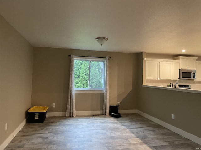 305 Hill Top Ct, New Carlisle, IN 46552 - unfurnished living room with wood finished floors and recessed lighting