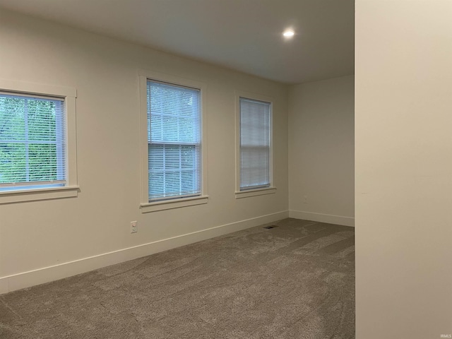 305 Hill Top Ct, New Carlisle, IN 46552 - spare room featuring dark carpet and recessed lighting