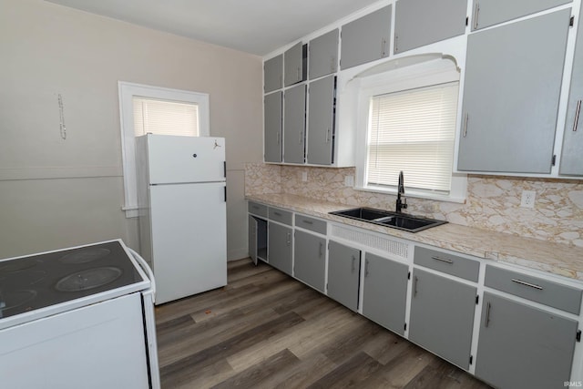 1722 Nash St, South Bend, IN 46613 - kitchen with white appliances, tasteful backsplash, and gray cabinets