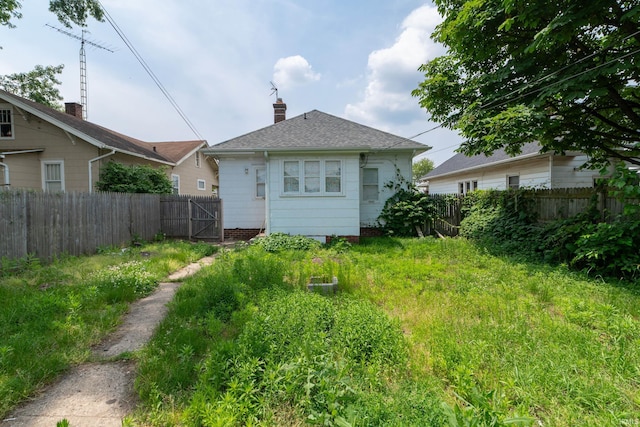 1722 Nash St, South Bend, IN 46613 - back of property featuring a chimney and a shingled roof