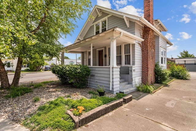 906 S Union St, Kokomo, IN 46901 - view of front facade with a chimney and covered porch