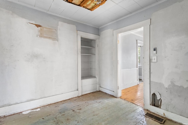 906 S Union St, Kokomo, IN 46901 - spare room with wood-type flooring and ornamental molding
