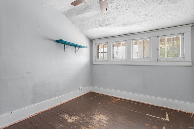 906 S Union St, Kokomo, IN 46901 - unfurnished room featuring hardwood / wood-style floors, a textured ceiling, vaulted ceiling, and a ceiling fan