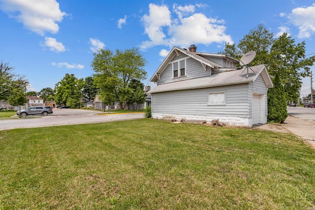 906 S Union St, Kokomo, IN 46901 - view of home's exterior featuring a chimney and a lawn