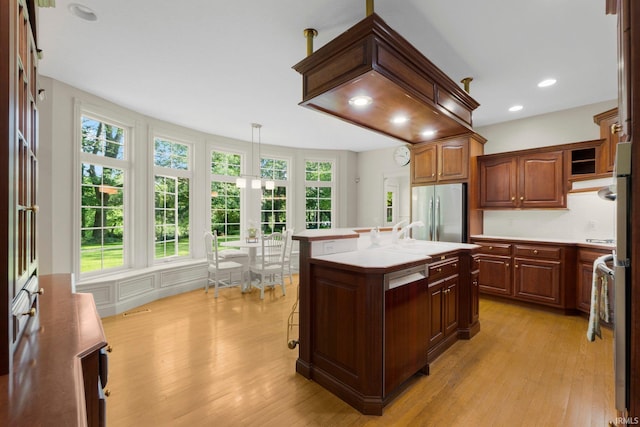 12217 Bay Heights Blvd, Grabill, IN 46741 - kitchen with light countertops, healthy amount of natural light, freestanding refrigerator, light wood-style floors, and recessed lighting
