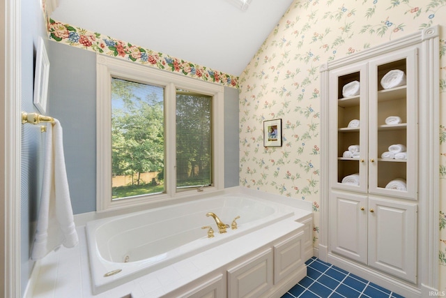12217 Bay Heights Blvd, Grabill, IN 46741 - bathroom with wallpapered walls, lofted ceiling, a whirlpool tub, and tile patterned floors
