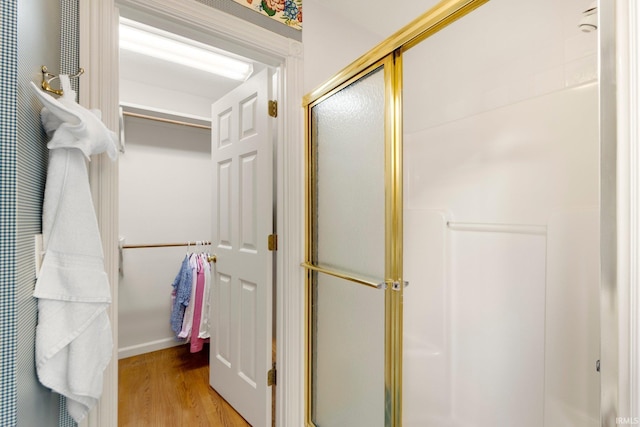 12217 Bay Heights Blvd, Grabill, IN 46741 - bathroom with a stall shower and wood finished floors