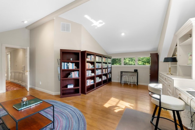 12217 Bay Heights Blvd, Grabill, IN 46741 - living area with vaulted ceiling and light wood-style flooring