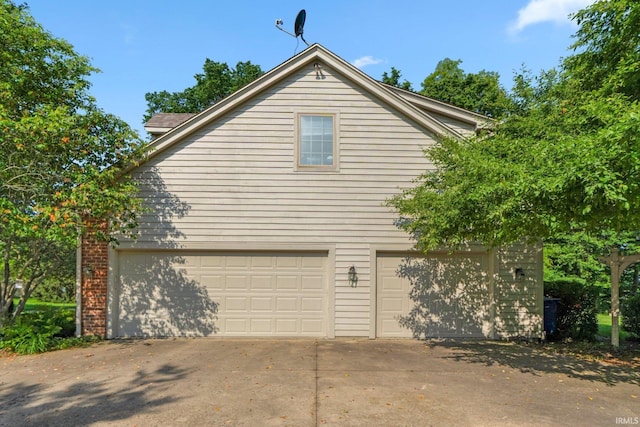 12217 Bay Heights Blvd, Grabill, IN 46741 - view of property exterior featuring a garage and driveway