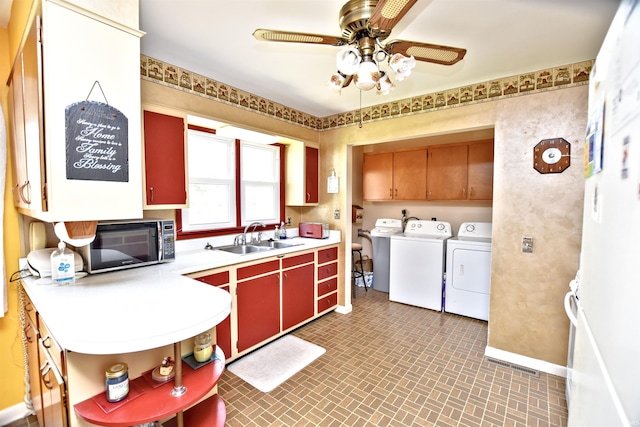 2885 E Bradford Ct, Monon, IN 47959 - kitchen with washing machine and dryer, black microwave, ceiling fan, light countertops, and open shelves