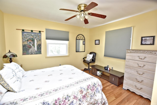 2885 E Bradford Ct, Monon, IN 47959 - bedroom with light wood-style flooring and a ceiling fan